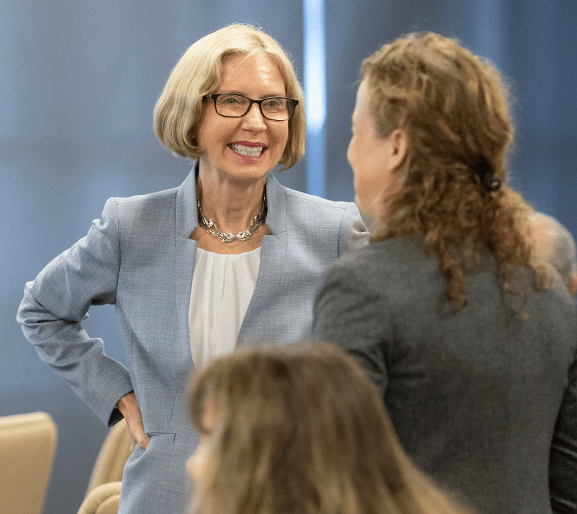 Dr. Wendy Rheault talking to a person